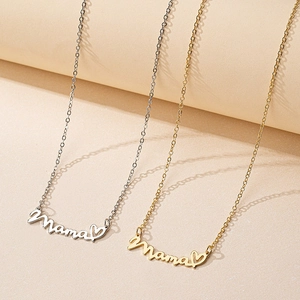 Elegant gold and silver Mama pendant necklaces with heart detail on beige background