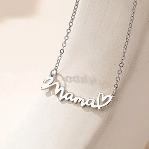 Silver Mama letter necklace with hollow heart pendant on elegant white stone background