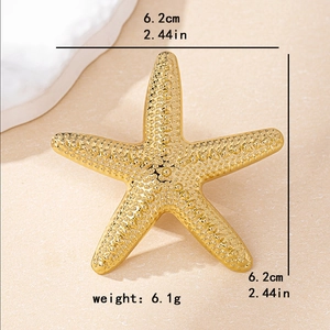 Exaggerated gold starfish ring with textured relief for a bold vacation jewelry look