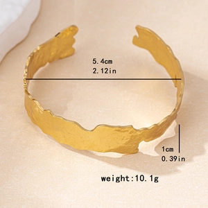 Gold irregular textured open cuff bracelet with vintage geometric hammer finish design