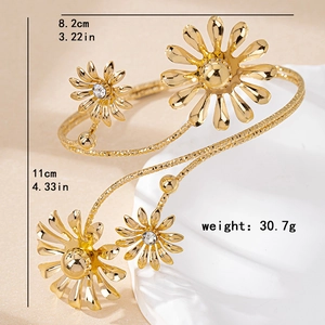Elegant gold daisy adjustable upper arm cuff with floral motifs and rhinestone details