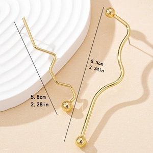 Minimalist gold geometric asymmetrical earrings featuring linear and wavy drop design