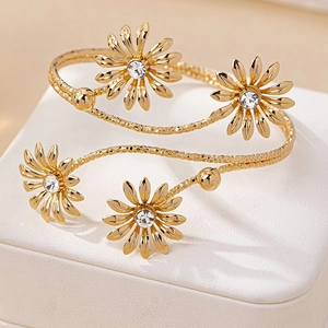 Gold daisy open bracelets with sparkling crystals and elegant spiral texture design