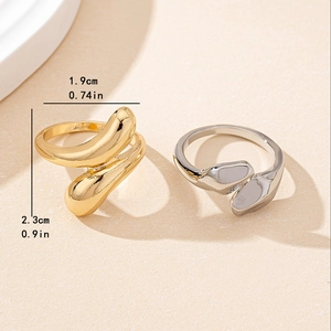 Set of minimalist gold and silver snake rings with fluid organic geometric design