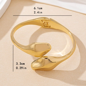 Minimalist gold snake-shaped open bracelet with dimensions 6.1cm by 3.3cm for women