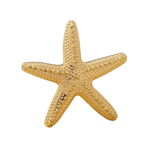 Chic gold starfish ring for women with textured relief and a polished metallic finish