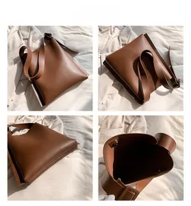 Detail view of brown PU leather tote bag with adjustable shoulder strap and magnetic snap