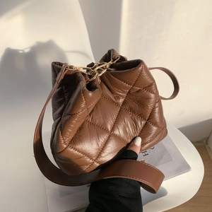 Brown quilted bucket bag for women with large capacity and elegant gold metal hooks