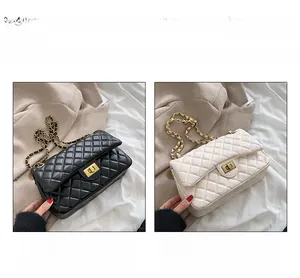Detail of 20cm quilted leather crossbody bag with chain strap in black and white