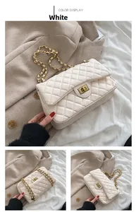 Detailed view of white quilted chain bag with gold rotating lock and woven leather strap