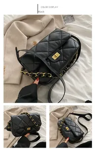 Détails du sac matelassé noir avec boucle dorée et bandoulière en chaîne de cuir