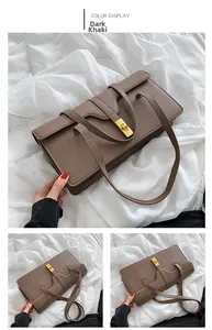Detail of a deep khaki leather square bag with vintage gold metal twist lock and thin straps