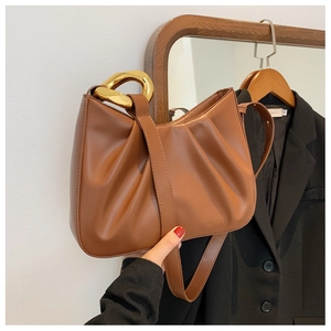 Brown pleated cloud bucket bag with chunky gold chain handle and shoulder strap