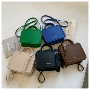 Collection of chic square crossbody bags in green, blue, beige, black, and brown leather