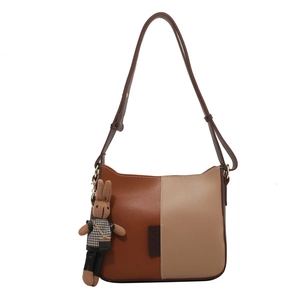 Sac bandoulière bicolore minimaliste avec bandoulière réglable et pendentif lapin