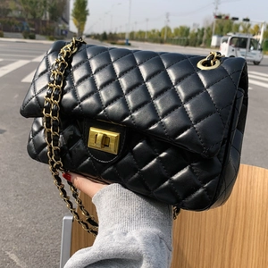 Classic black quilted leather crossbody bag with gold chain strap and turn-lock closure