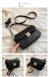 Detailed views of a black crocodile-textured crossbody bag with golden metal buckle clasp