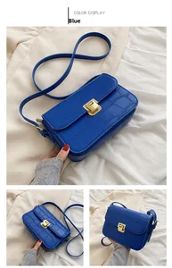 Close-up of blue crocodile pattern PU leather with a golden rectangular metal lock