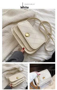 Detailed view of cream-white quilted shoulder bag featuring a round golden metallic twist-lock