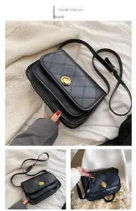 Detail of black quilted crossbody bag with golden twist lock and slim shoulder strap