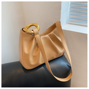 Detail view of apricot pleated cloud bag featuring premium gold chain hardware and soft PU leather
