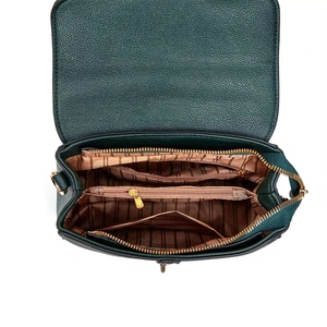 Detail view of dark green pebbled leather handbag with brown striped fabric lining and gold zipper