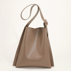 Minimalist taupe PU leather shoulder bag with adjustable strap and wide opening