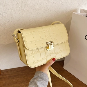 Chic cream yellow crocodile pattern crossbody bag with golden hardware and square clasp