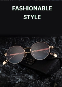 Macro detail of steampunk round sunglasses with gold frame and black leather case