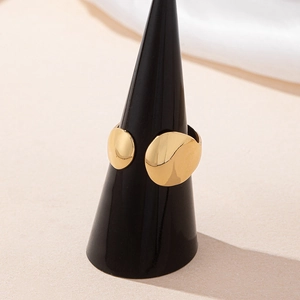 Minimalist gold open ring featuring smooth irregular double discs on a jewelry display stand