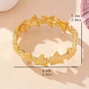 Golden sea star open bangle with textured starfish charms for beach vacation women