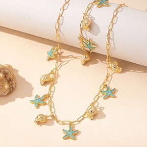 Goldenes Schmuckset mit Seestern und Muschel, blauem Emaille für den Ozean Urlaubsstil