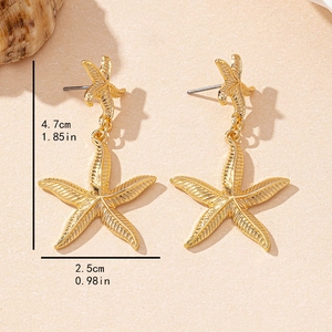 Vintage golden starfish drop earrings for women with detailed texture and beach style
