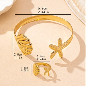 2-piece gold starfish shell jewelry set with open cuff bracelet and adjustable ring
