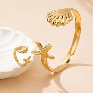 Golden starfish and shell jewelry set with adjustable open bangle and matching ring