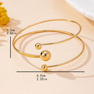 Minimalist gold multi-layered open bangle with beads and size dimensions shown