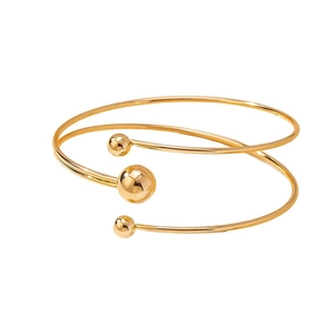 Minimalist gold spiral multi-layer bangle featuring polished sphere accents for women