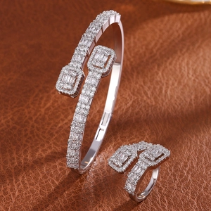 Luxe silver hip-hop jewelry set featuring iced-out open bracelet and matching ring on leather
