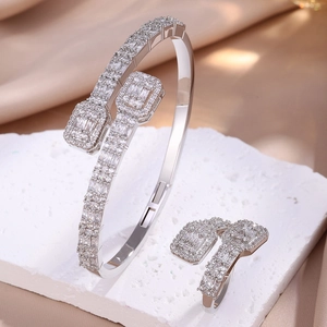 Elegant silver-plated iced out open bangle and ring set with baguette cubic zirconia
