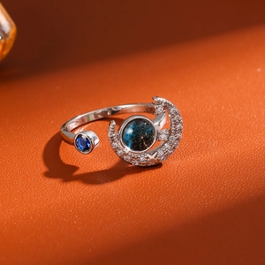 Star and moon open ring with blue stone and cubic zirconia in silver finish