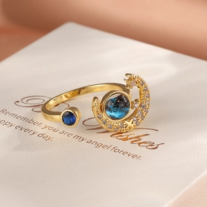 Detailed macro view of the star and moon ring with blue sandstone in golden finish