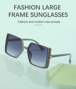 Detail of stylish oversized TR square sunglasses with gradient lenses and metal hinges