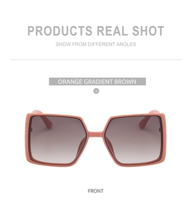 Front view of large square sunglasses with orange TR frames and gradient brown lenses