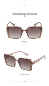Close-up of oversized TR polarized sunglasses with brown gradient lenses and metal trim