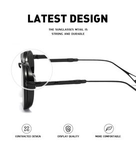 Detail view of oval frame sunglasses showing durable construction and sleek black temples
