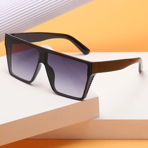 Square oversized sunglasses with black frames and purple gradient lenses on display