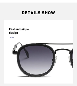 Detailed close-up of matte black round frame sunglasses with metal double bridge hinges