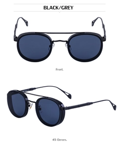 Close-up of retro double bridge metal sunglasses with dark grey lenses in black frames