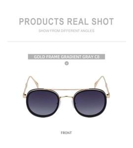 Front view of oval sunglasses with gold frame and gradient gray lenses C8
