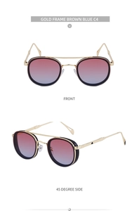 Detail view of gold metal double bridge sunglasses with brown blue gradient lenses